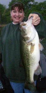 Sandy with her biggest bass ever, caught while fishing with Pro Guide Tom Redington