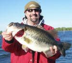 Mike with an 8 lb 11 oz bass he caught on 4/8 and a super fat 7-7 on 4/9.