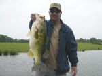 Beau Tackett from OK. with a 7# Lake Fork bass caught on May 5th.while fishing with Pro Guide Gary Johnson