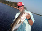 Pro Guide John Tanner with a summertime hog.