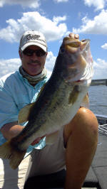 Pro Guide John Tanner with a trophy summer time bass