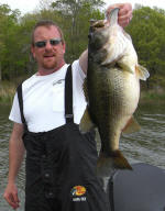John A. Collins from Rowlett Texas with an 11lb. 15oz. 24.5" Lake Fork trophy bass. Caught in 4ft. water. 62.5 degree water temp. 4:00pm Sunday March 30 2008. White 3/8oz. Chatterbait with Lake Fork Magic "swimming" Shad white/silver-silver fleck. Caught in a cove in Little Caney. 