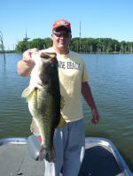 Nick Smith, with a Lake Fork bass weighing just under 9 lbs, and 25 inches long. Tried to book a guide and couldn't get one available.  Do-it-yourselfer kind of trip.  Caught is spawn, in 13 ft water, 3:30 pm, 73 degree water temp. May 3rd, 2008.