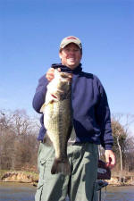 Pro Guide Tom Redington with a 7.75 Lake Fork bass caught on a Rattletrap.