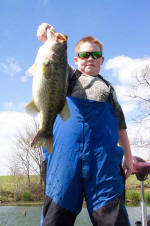 13 year old Andrew Giles from Mississippi with a 6lb bass he caught fishing with Pro Guide Tom Redington.