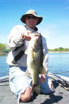 Cory Winters with a big bass over 7lbs, caught on a Lake Fork Trophy Tube.  Cory was fishing with Pro Guide Tom Redington