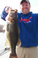 Lake Fork Pro Guide Tom Redington with a 8.5 lb'er caught 1-20-06 on a spinnerbait along a 3' grassline. 