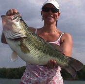 Ruth Diautos with a trophy bass she caught while fishing with Pro Guide John Tanner.