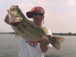 Michael Hebron from Waco TX with a 8.25, his personal best. Hot weather bassin is awesome, he says, while fishin with John Tanner! 