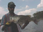 Howard Tirrell from Sulphur Springs, TX with an 8 lb plus Lake Fork bass caught in 5 1/2 to 6 ft of water on top water rig.