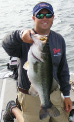 Pro Guide Tom Redington with a 7.5 lb largemouth that came on a Mega Weight Jig. 