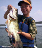 11 year old Gage Hubbard with a 8 pound fish caught with Pro Guide John Tanner on 8/1.