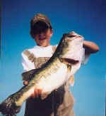 13 year old T. Bounds from Arkansas displays his Lake Fork catch, a 7 1/4 lb bass caught 7-22-03