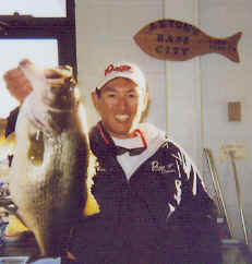 Omori displays a 9 lb. lake fork bass caught January 6, 2002
