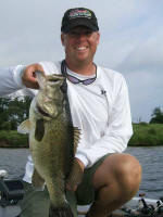 Pro Guide Tom Redington with a nice Lake Fork bass  caught on a black/brown/amber Lake Fork Tackle jig
