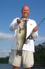 Pro Guide Tom Redington  with a 9 lb. bass caught on Carolina rigged Lake Fork Baby Creature. 