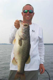 Pro Guide Tom Redington  with a 7 lb 9 oz bass caught on Carolina rigged Lake Fork Baby Creature.