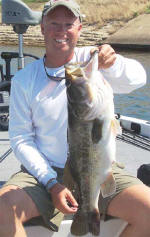 Pro Guide Tom Redington  with another bass caught on Carolina rigged Lake Fork Baby Creature. This one-eyed measured a whopping 25-3/4" and came in right at 10 lbs