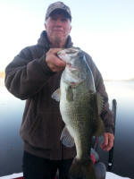 Monty Montgomery with a nice bass caught while fishing with JW Peterson