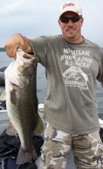 Kevin with a 7 lb 4 oz lunker, caught fishing with Pro Guide Tom Redington.