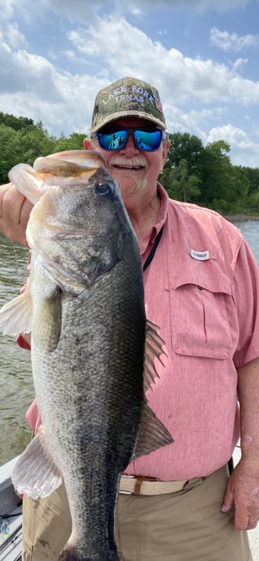 Lake Fork Guide Tom Evans with a bass caught while fishing Lake Fork